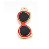 Pendentif oeil articulé + zircon vert
