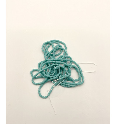 Rocaille tube facette turquoise opaque sur fil